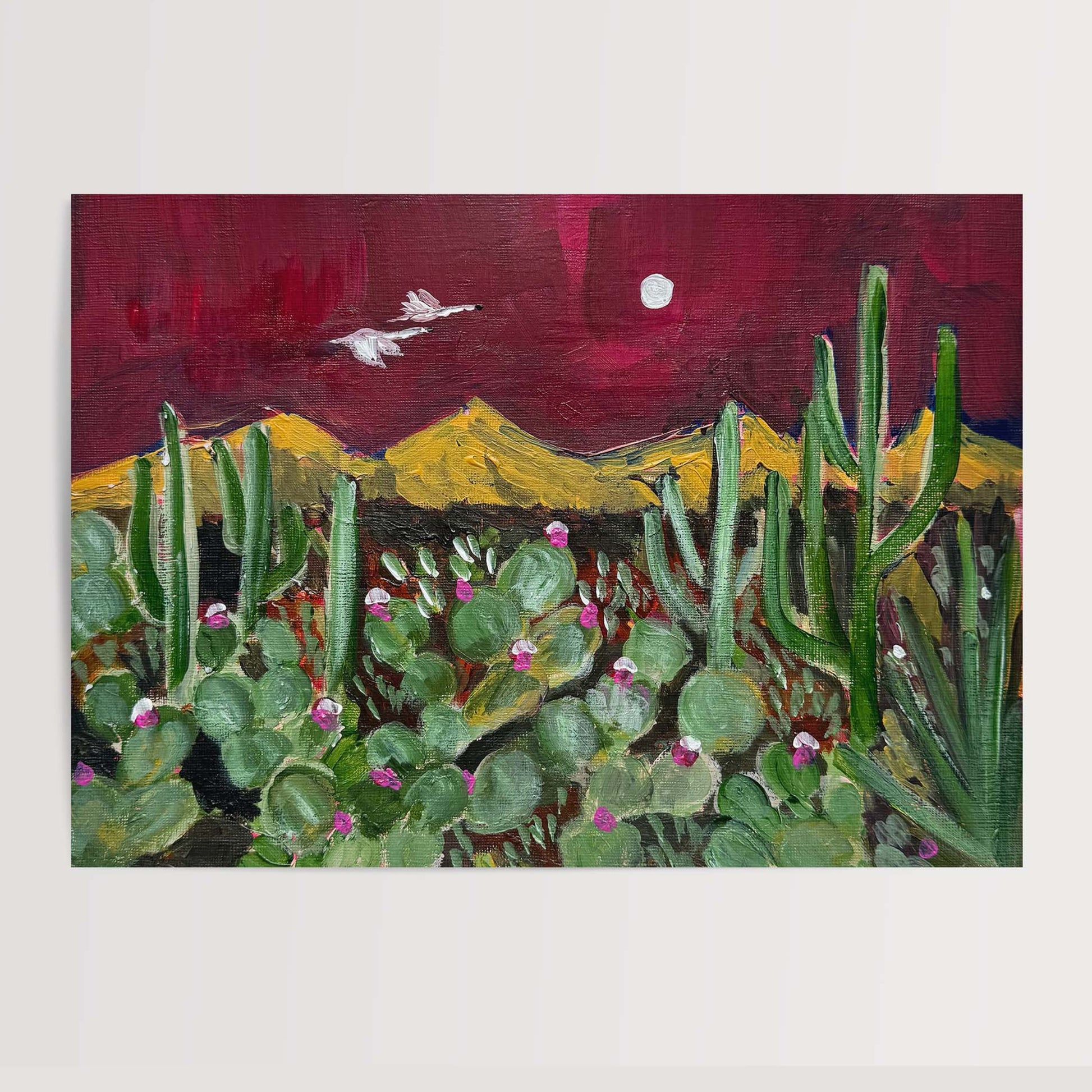 Painting of a desert landscape with cacti and a red sky.