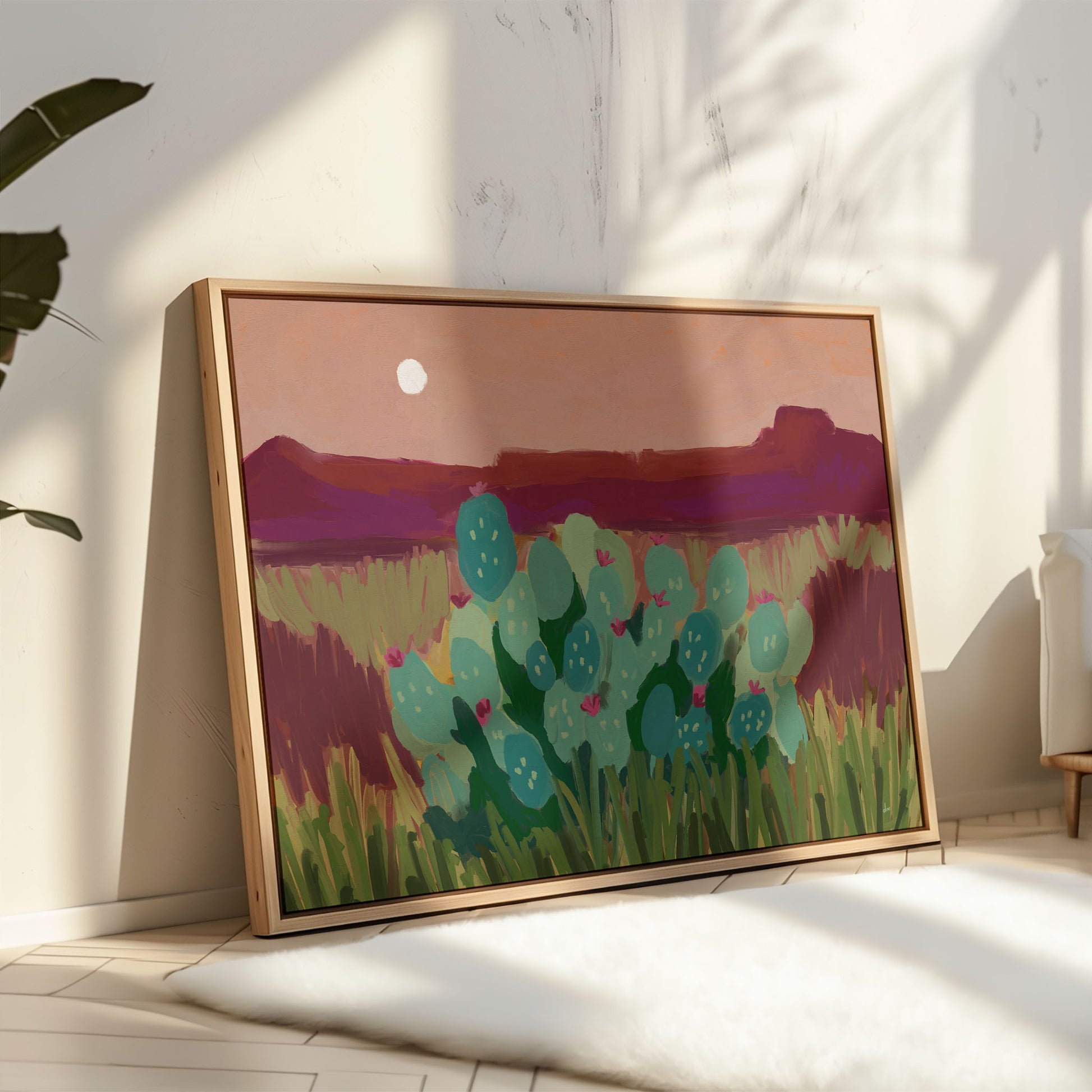 Colorful desert wall art print featuring prickly pear cacti, layered magenta mountains and a glowing moon at dusk